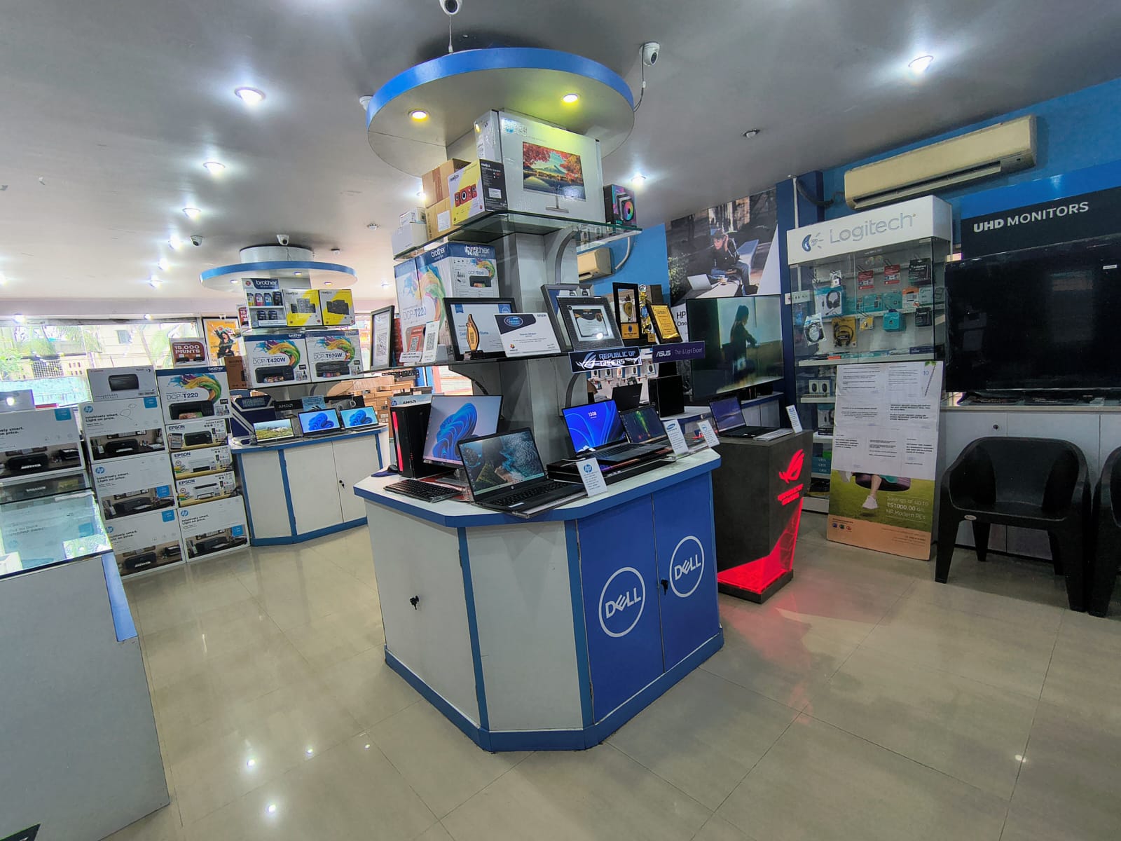Wide interior view of the Syscom Infotech showroom in Barasat
